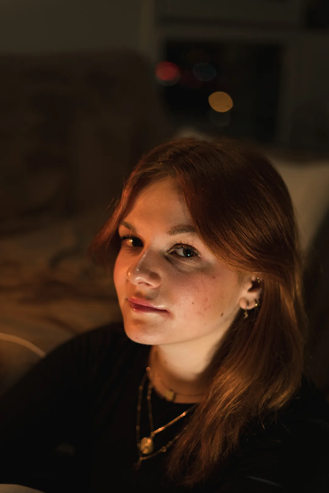 photo of a woman orange tones studio lights
